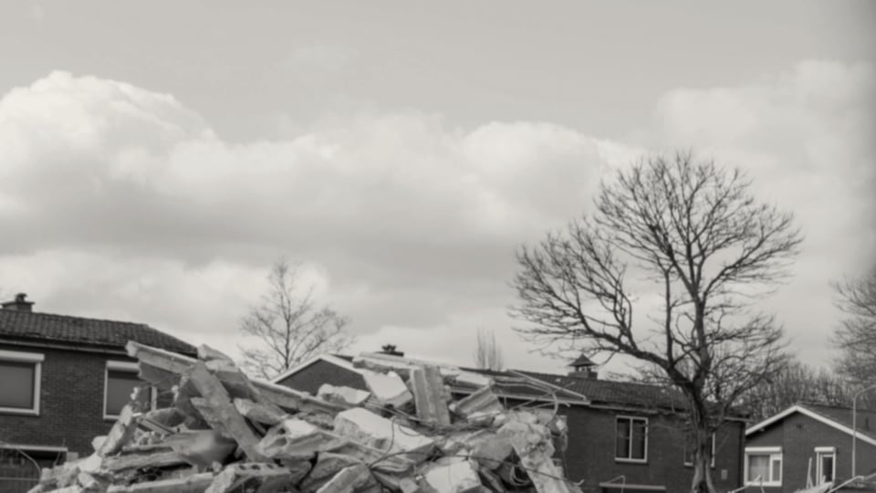 Crushed concrete and demolition aggregate stockpile on a UK demolition site